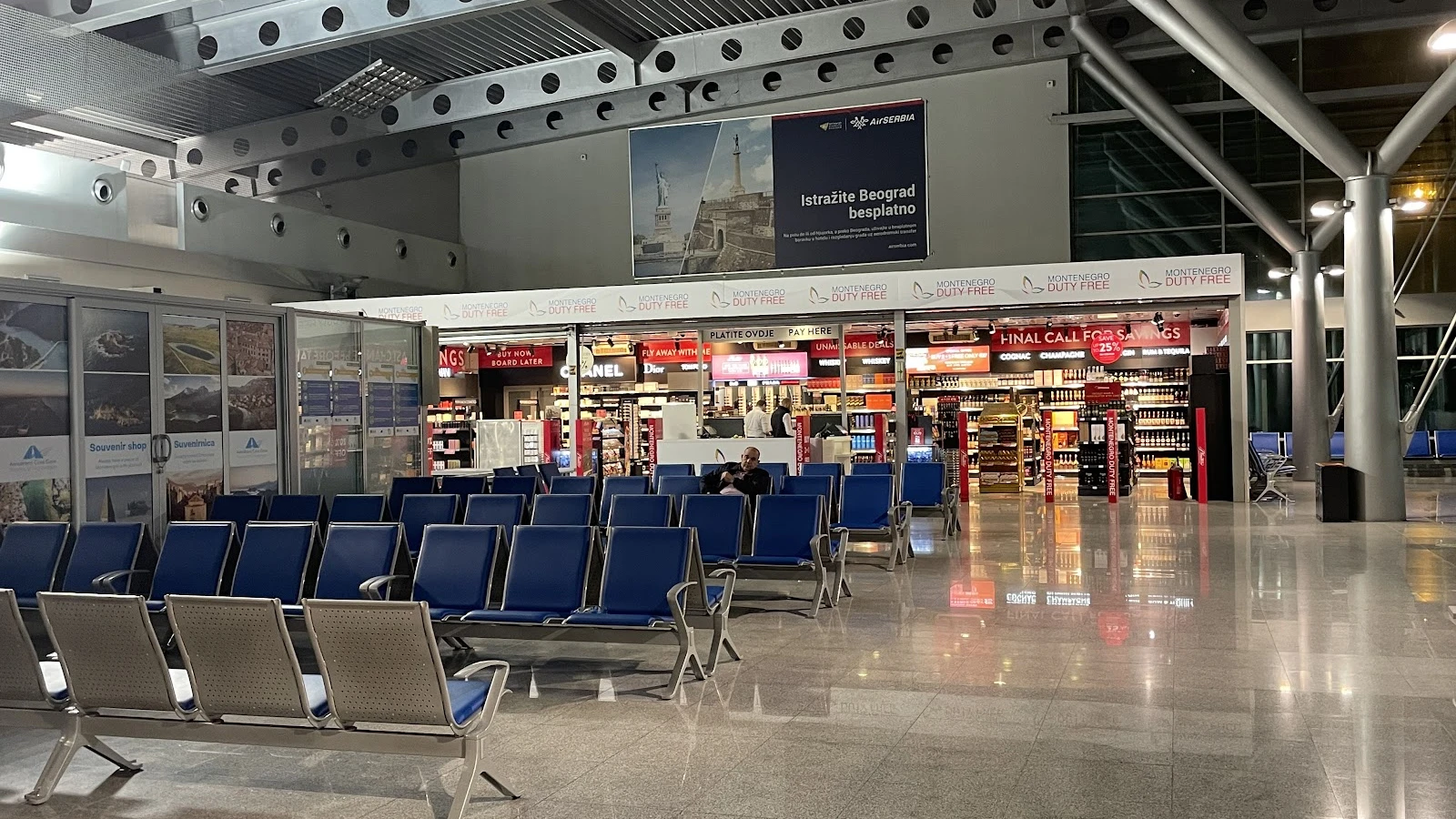 Car hire service desk at Podgorica Airport arrivals with GPS and child seat extras
