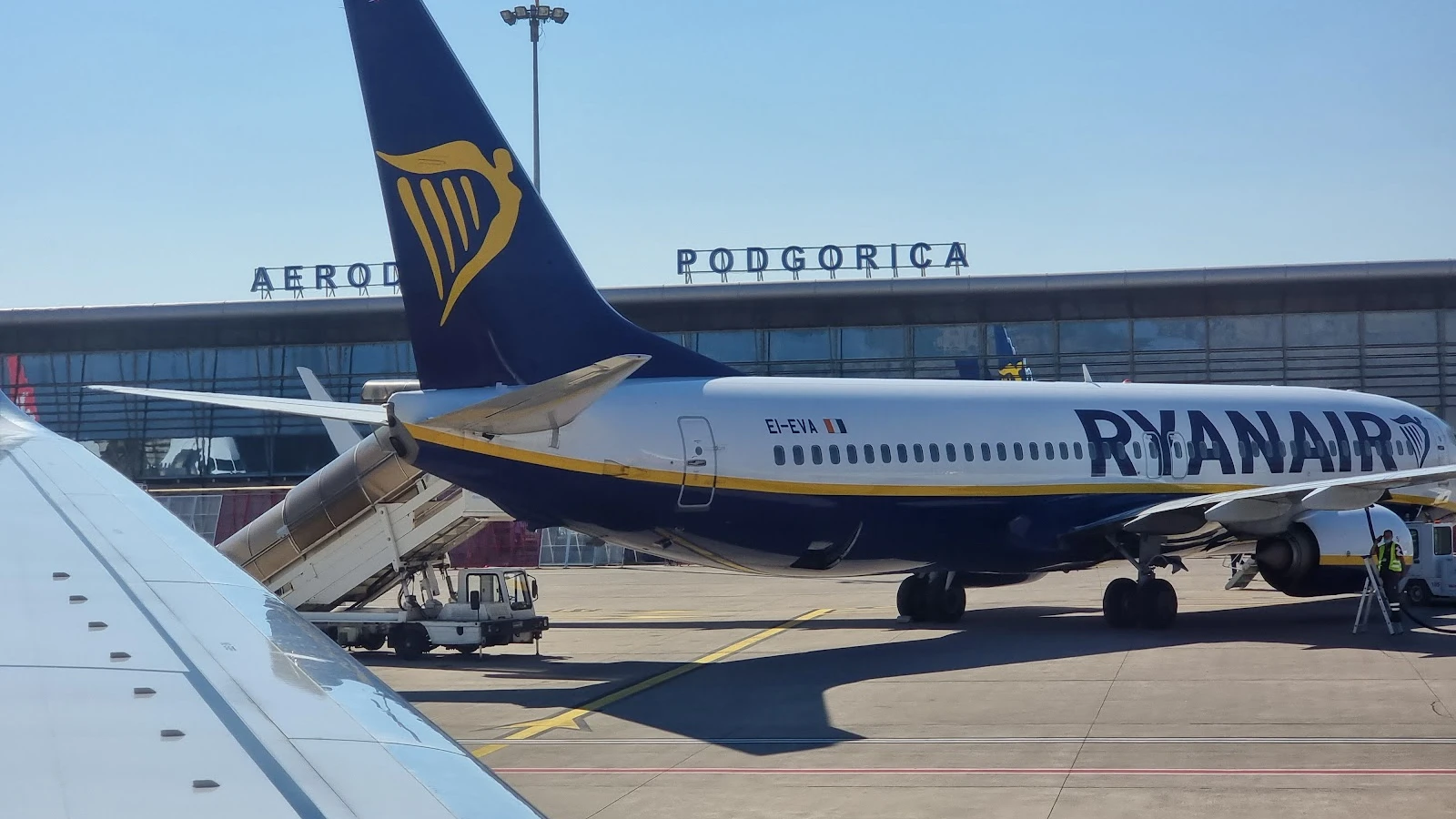 Podgorica Airport parking area and fuel station near car rental return zone